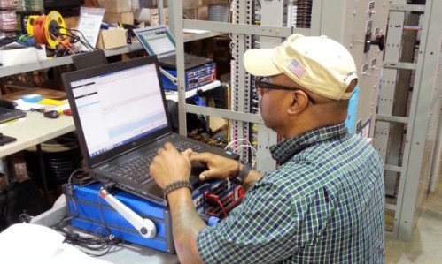 Technician working on protective relay testing